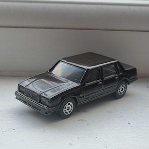 Hand-restored die-cast car Vintage Corgi Juniors, 1:64, Volvo 740 / 760, high-gloss two stage dark grey.