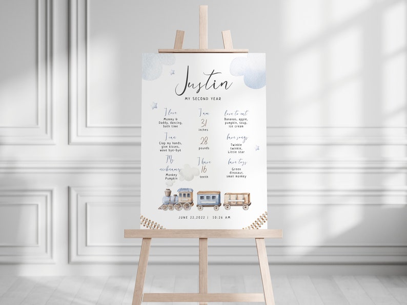 May include: A blue and white printable poster with a train theme. The poster is for a child's second birthday and includes the child's name, Justin, and details about their growth and development. The poster includes information about the child's height, weight, favorite foods, and favorite songs. The poster also includes a cute illustration of a train.