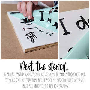 May include: A close-up of a white wooden sign with black lettering and decorative elements. A hand is peeling away a light blue stencil, revealing the design. The text on the sign reads, "I do".