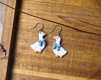 Silly Goose Dangle Earrings! White polymer clay geese with sweet pink or blue bows.