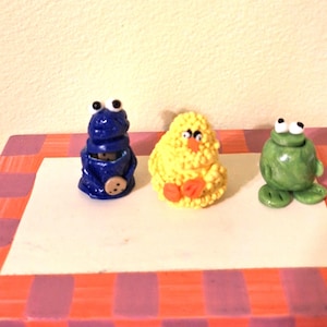 Dollhouse miniature Sesame Street inspired cookie jars filled with cookies