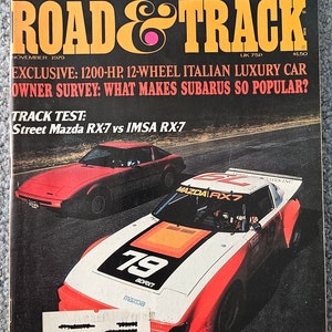 May include: A magazine cover for Road & Track magazine, November 1979, featuring a red Mazda RX-7 race car with the number 79 on the hood. The cover also features the text "TESTED: ROLLS-ROYCE SILVER SHADOW II, FERRARI DINO 308 GT4 & VW SCIROCCO 5-SPEED" and "EXCLUSIVE: 1200-HP, 12-WHEEL ITALIAN LUXURY CAR".