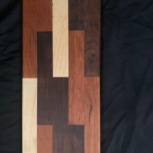 A handmade wood charcuterie board