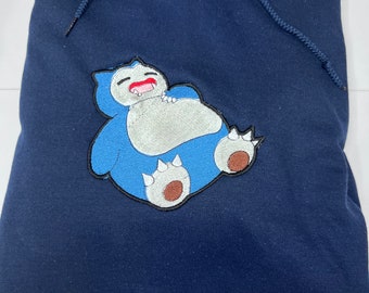 Snorlax Embroidered Sweatshirt, Custom Initial Sleeve Snorlax Embroidered Hoodie, Snorlax Fan Gifts Custom Embroidered Crewneck Sweatshirt