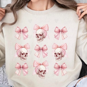 Dark Coquette Skull with Bow Crewneck Sweatshirt Pink Preppy Halloween Coquette Hoodie Soft Gothic Clothes Balletcore Aesthetic Pastel Goth Sweater Plus Size Halloween Kids Emo Valentine Skull Hoodie Trendy Spooky Season Outfit Wild Heart Studio TX
