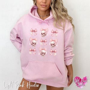 Dark Coquette Skull with Bow Crewneck Sweatshirt Pink Preppy Halloween Coquette Hoodie Soft Gothic Clothes Balletcore Aesthetic Pastel Goth Sweater Plus Size Halloween Kids Emo Valentine Skull Hoodie Trendy Spooky Season Outfit Wild Heart Studio TX