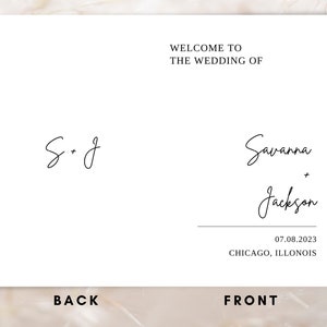 May include: A white wedding invitation with the text "Welcome to the wedding of Savanna + Jackson" and the date "07.08.2023" and the location "CHICAGO, ILLINOIS". The back of the invitation has the initials "S + J" written in cursive.
