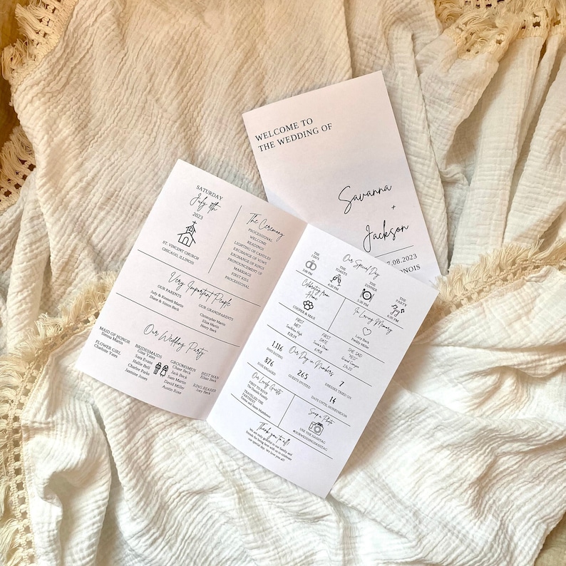 May include: A wedding program with a white background and black text. The program includes the ceremony details, the wedding party, and the reception information. The program is folded in half and the front cover has the names Savanna and Jackson and the date 1.08.2023.