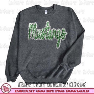 May include: A dark gray sweatshirt with the word "Mustangs" in green glitter letters.