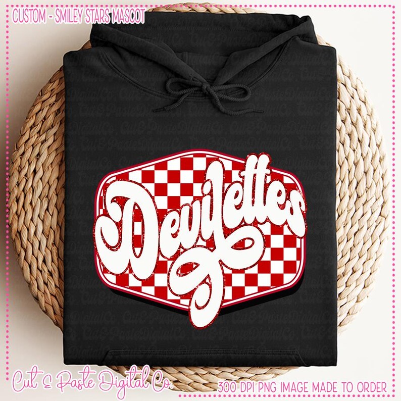 May include: Black hoodie with a red and white checkered design and the text "Devitelles" in white. The design is in the shape of a rounded rectangle.