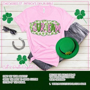 May include: A pink t-shirt with the text "YOUR TEAM" in a green and pink bubble design, paired with a green hat, jeans, and a horseshoe. The shirt has the text "CHECKERED.ST..PATRICK'S.DAY-BUBBLE" at the top. The image also includes the text "Cut-Paste-Digital Co".