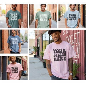 May include: Six different men are wearing t-shirts with the text "YOUR DESIGN HERE" in a variety of colors and fonts. The shirts are all casual and comfortable, and they would be perfect for everyday wear.
