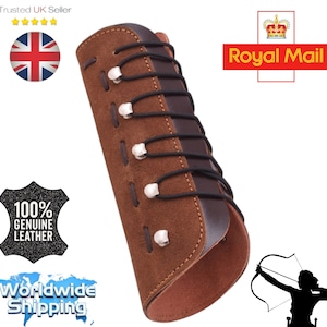 May include: Brown leather archery arm guard with black lacing and silver-toned eyelets. The guard is made of genuine leather and is designed to protect the forearm. The image also includes a silhouette of an archer.