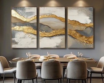 May include: A triptych wall art set featuring three rectangular canvases with abstract landscape designs. The artwork displays layered horizontal bands of textured gold leaf, charcoal gray, and white paint with visible brushstroke details.