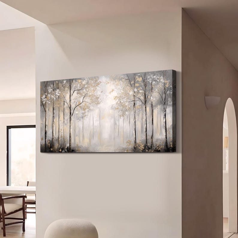 May include: A long, horizontal canvas painting depicting a misty forest scene. The trees are painted in shades of gray and brown, with hints of gold. The background is a soft, hazy white.