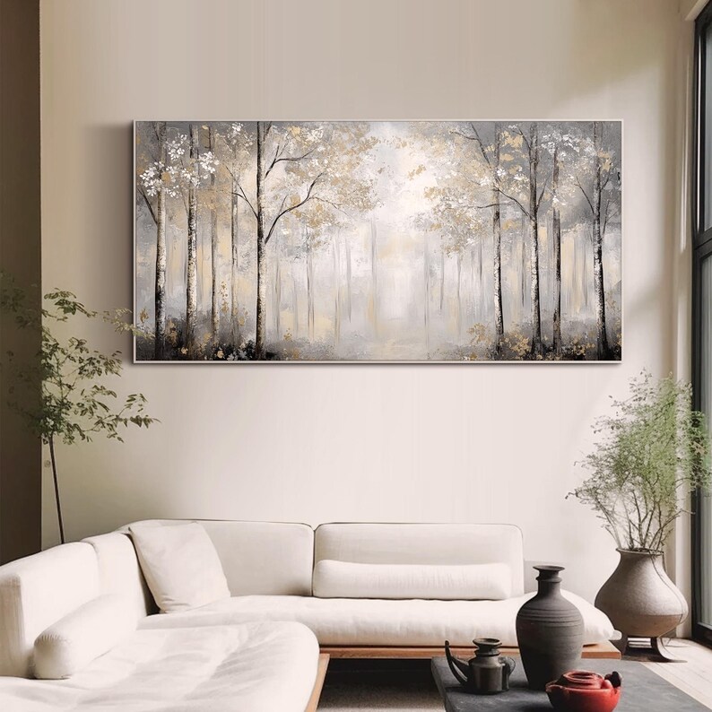 May include: A long, horizontal painting depicting a misty forest scene with tall, slender trees in shades of gray and white. The trees are clustered together, creating a sense of depth and mystery. The background is a soft, hazy gray, suggesting a foggy or overcast day. The painting has a calming and serene atmosphere.