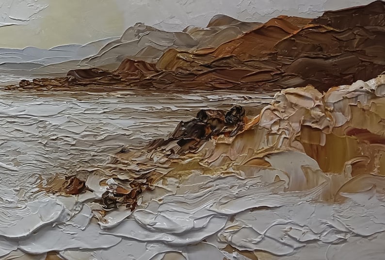 May include: An oil painting on canvas featuring a coastal landscape with thick impasto brushstrokes. The scene depicts white crashing waves against rocky brown cliffs under a pale sky. The texture is highly raised, creating a tactile surface.