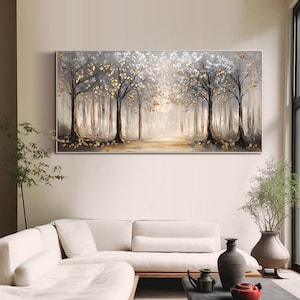 May include: A rectangular landscape painting featuring a forest scene with dark tree trunks and branches against a light gray background. The trees are adorned with textured gold and white leaves, with gold accents scattered on the ground below.