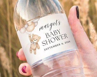 Pode incluir: Etiqueta de garrafa de água com um urso de peluche a segurar balões. A etiqueta diz "margot's baby shower September 4, 2024".