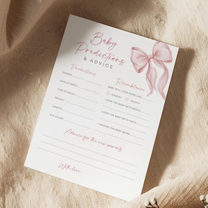 May include: A white baby shower prediction and advice card with pink text and a watercolour bow illustration. The card includes sections for predictions about the baby's gender, date of birth, and resemblance to parents. It also has space for advice for new parents.
