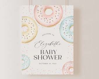 Puede incluir: Una invitación a una baby shower con temática de donas. La invitación presenta tres donas con glaseado rosa, azul y amarillo y chispas. El texto de la invitación dice "Bienvenido a la baby shower de Elizabeth, 24 de octubre de 2023".