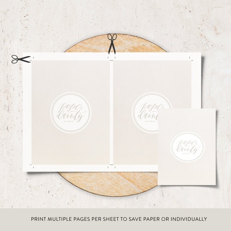 May include: A light beige paper layout with the text "PRINT MULTIPLE PAGES PER SHEET TO SAVE PAPER OR INDIVIDUALLY". The paper has a circular logo that says "Paper Dainty Studio". Scissors are cutting the paper.