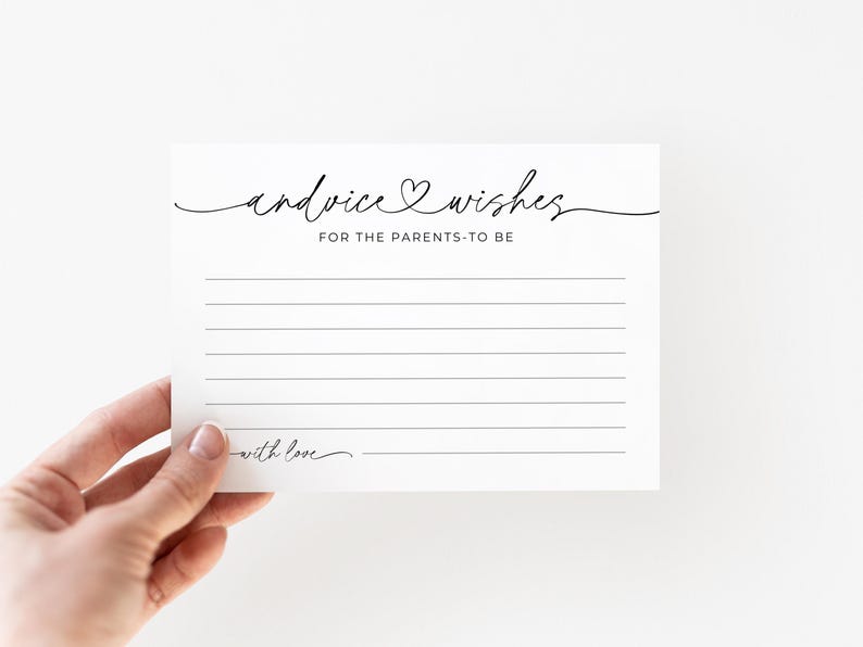 May include: A white card with the text "advice & wishes FOR THE PARENTS-TO-BE" in black script. The card has lined spaces for writing and the words "with love" at the bottom. The card is held by a hand.