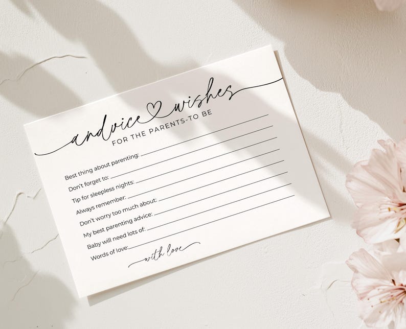 May include: A white card with the words "advice & wishes for the parents-to-be" in elegant script. The card has lines for advice, with prompts like "Best thing about parenting" and "Words of love."