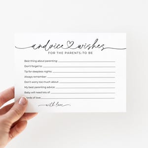 May include: A white card with black script that reads "advice & wishes FOR THE PARENTS-TO-BE." The card has prompts for advice on parenting, such as "Best thing about parenting" and "My best parenting advice." The words "with love" are also written on the card.