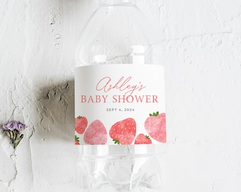 May include: A white water bottle label with pink watercolor strawberries and the text "Ashley's Baby Shower Sept 4, 2024".