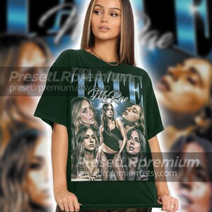 Może przedstawiać: Zielony T-shirt z nadrukiem graficznym z wyblakłym wizerunkiem twarzy kobiety i tekstem "FATE Me Rae".