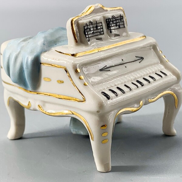Vintage porcelain miniature small grand piano figurine with sheet music gold rims drapes