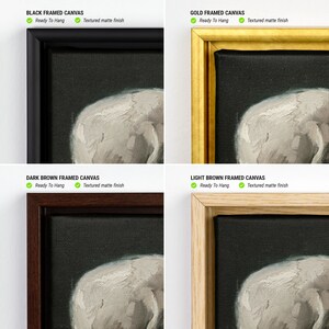 May include: A close-up of a framed canvas print of a skull. The canvas is available in four frame colours: black, gold, dark brown, and light brown. The canvas is ready to hang and has a textured matte finish.