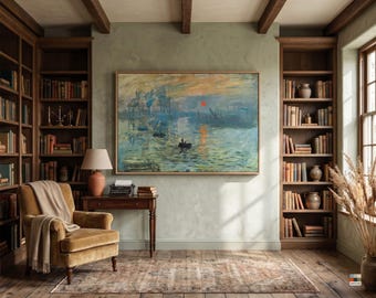May include: A framed impressionist landscape painting depicting a harbour at sunrise with a red sun, small boats, and blue-toned water, mounted on a light green wall between two tall wooden bookshelves filled with books and decorative items.