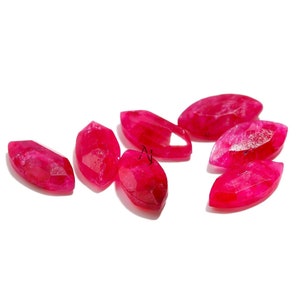 May include: Six bright pink, faceted, marquise-shaped gemstone beads. The beads are smooth and polished.