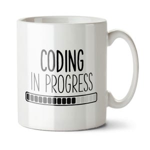 May include: White ceramic mug with a black and grey progress bar graphic and the text "Coding in Progress".
