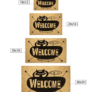 May include: A set of four doormats with a retro design featuring a black cat and the word "WELCOME" in a stylized font. The doormats are available in four sizes: 18x12 inches, 24x16 inches, 30x18 inches, and 36x24 inches.