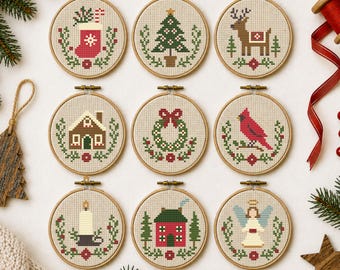 May include: Nine circular wooden embroidery hoops containing cross-stitch patterns featuring Christmas themes including a stocking, tree, reindeer, gingerbread house, wreath, cardinal, candle, cottage, and angel on light fabric.