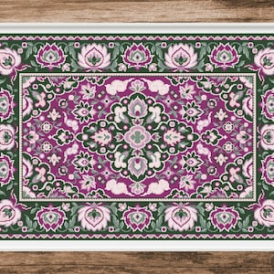 Puede incluir: Una alfombra decorativa con un patrón floral rosa y verde. La alfombra tiene un diseño detallado con detalles intrincados y un borde.