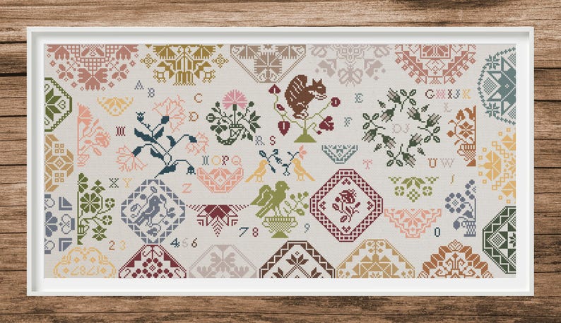 May include: Framed cross-stitch sampler with a variety of floral, animal, and geometric patterns in a palette of muted colors. The design includes a squirrel, birds, and floral motifs, with letters and numbers.