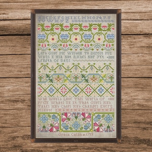 May include: Framed cross-stitch sampler with a wooden frame. The sampler features floral and geometric patterns in green, blue, pink, and yellow. Text includes the alphabet and a quote: "Lord give me wisdom..." Signed "Grace Catlin 1719".