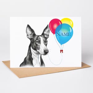 May include: A greeting card with a black and white dog illustration, holding three balloons. The balloons are red, yellow, and blue, with the word "NAME" on the blue balloon. The card is on a brown envelope.