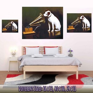 May include: A white dog with black spots listens intently to a vintage gramophone with a golden horn. The dog is sitting on a dark brown floor with a dark green background. The gramophone is on a wooden table with a white cloth.