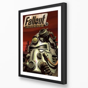 K&ouml;nnte beinhalten: Gerahmtes Fallout-Poster mit einer detaillierten Illustration eines Power-Armor-Helms und dem Logo des Spiels. Das Kunstwerk hat ein postapokalyptisches Thema mit rotem und orangefarbenem Hintergrund, und das Poster ist in einem schwarzen Rahmen.