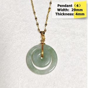 May include: A gold-colored chain necklace with a pendant. The pendant is a double-layered, light green jade disc, 29mm wide and 4mm thick, with a central hole. The text "Pendant (4) Width: 29mm Thickness: 4mm" is visible.