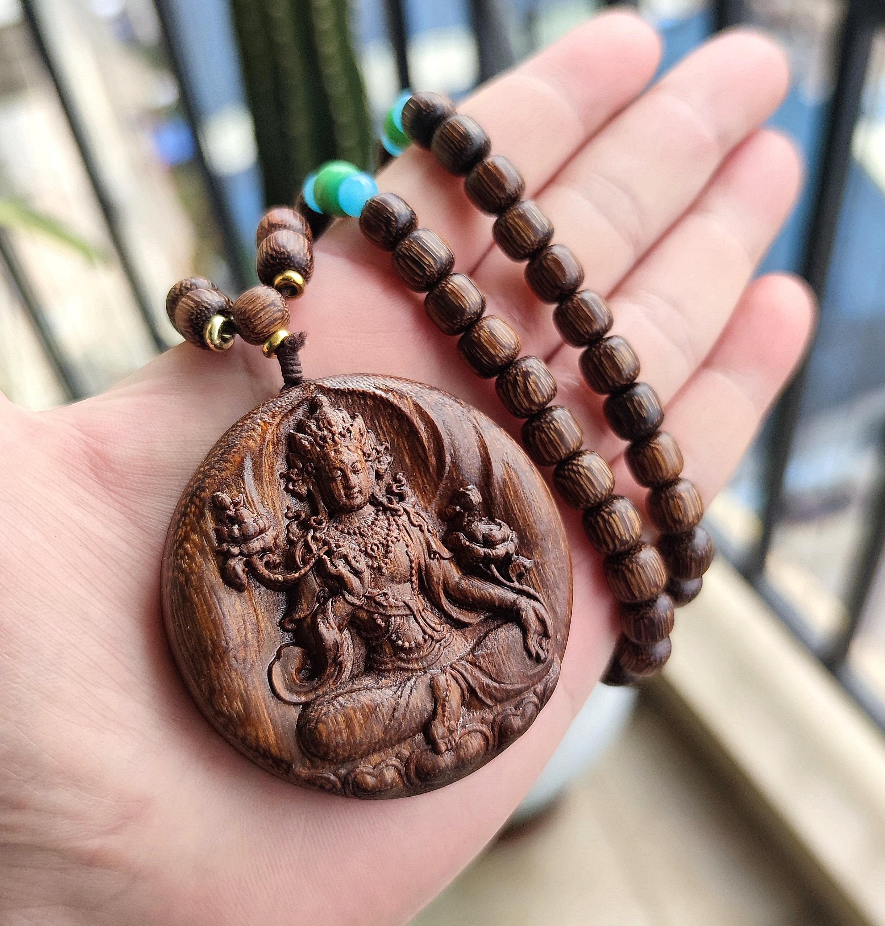 Wooden buddha necklace discount