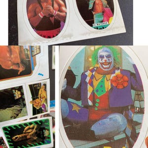 May include: A collection of vintage wrestling trading cards. The cards feature colorful illustrations of wrestlers in action, including a clown-like character and other athletes in various poses. The cards are in an oval shape.