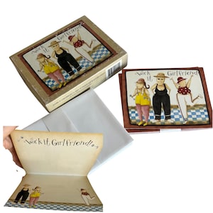 May include: A boxed set of note cards and envelopes titled Work it Girlfriend. The cards feature an illustration of three figures in hats exercising on a blue and white checkered floor. The interior of the card displays the same illustration.