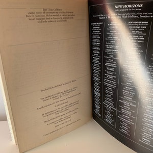 May include: An open book with a brown cover and white text. The book title is "New Horizons" and the text lists a variety of historical and cultural topics. The book is open to a page with a biography of Jean-Louis Gaillemin, the author of the book.