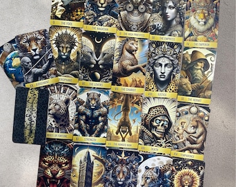 May include: A set of 22 tarot cards with gold accents and images of animals, including a leopard, a lion, and a monkey. The cards are numbered 0 through 21 and have names like "The Fool", "The Magician", and "The Empress".